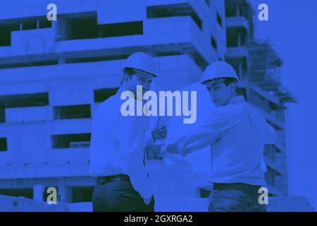Team of architects people in group  on construciton site check documents and business workflow Stock Photo