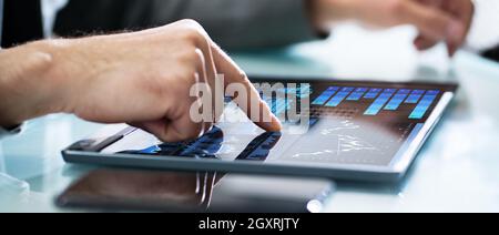 Investor Mobile Dashboard Analytics Data On Tablet Stock Photo
