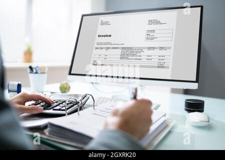 Professional Chartered Accountant Using Electronic Invoice Bill Software Stock Photo