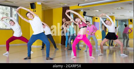 Teenagers practicing dance in studio Stock Photo