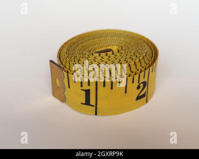 measuring tape flexible ruler ribbon for tailoring with imperial units Stock Photo