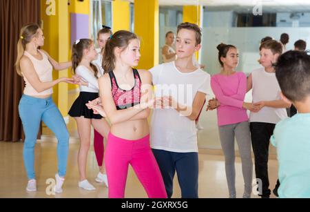 Children dancing rock-and-roll in pairs Stock Photo