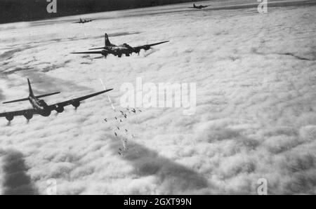 Boeing B-17 Flying Fortress bombers area bombing German cities  by radar during the combined Allied strategic bombing campaign. The USAF bombed by day and the RAF bombed by night. Stock Photo