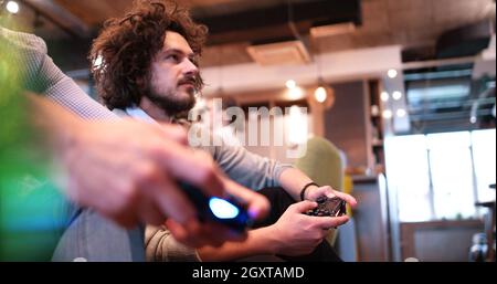 Work hard play hard. Office Workers Playing computer games Stock Photo ...