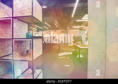 software developers working everyday job writing programming code at modern sunny bright open plan office Stock Photo