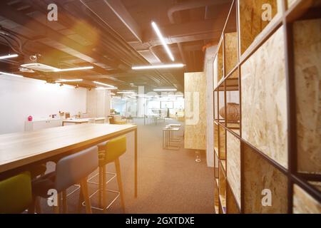 young software developers enjoying break in relaxation area of Modern sunny bright Open Plan Office Stock Photo