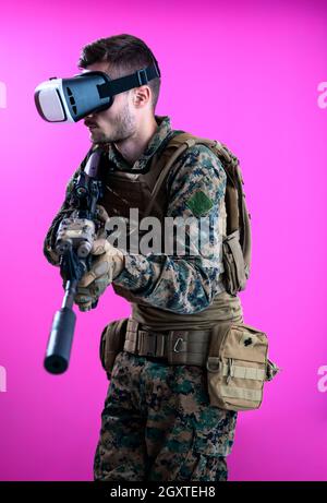 modern warfare futuristic soldier in battle  using vr virtual reality glasses Stock Photo