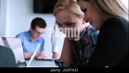 casual business people having meeting in corporate enviroment Stock Photo