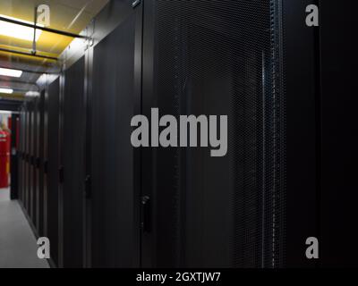 modern server room with black servers and hardwares in a internet data center Stock Photo