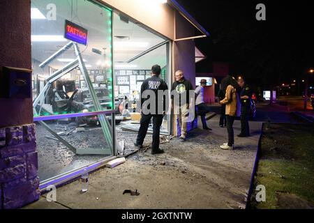 October 5, 2021: A car slammed into the Stainless Studios - Custom Tattoo Parlor in Dallas TX after being struck by another car, destroying a customer sitting area and tattoo station.None of the shop's employees or the occupants of the car were injured. The shop manager said that if a customer had not cancelled her appointment for this evening, they would have been sitting in that station when the vehicle struck.The other car fled the scene, minus a bumper, and is being sought by the Dallas Police Department. (Credit Image: © Avi Adelman/ZUMA Press Wire) Stock Photo