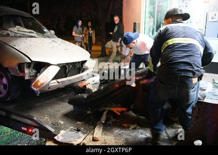 October 5, 2021: A car slammed into the Stainless Studios - Custom Tattoo Parlor in Dallas TX after being struck by another car, destroying a customer sitting area and tattoo station.None of the shop's employees or the occupants of the car were injured. The shop manager said that if a customer had not cancelled her appointment for this evening, they would have been sitting in that station when the vehicle struck.The other car fled the scene, minus a bumper, and is being sought by the Dallas Police Department. The errant vehicle is dragged out of the parlor by the wrecking service. (Cr Stock Photo