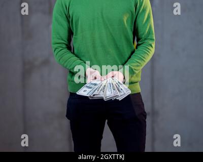 Business Man Displaying a Spread of Cash over a office background Stock ...