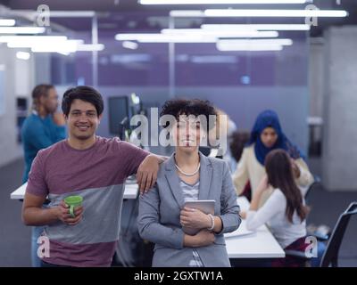 portrait of successful business couple software developers at busy startup office Stock Photo