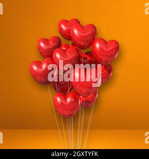 Red heart shape balloons bunch on a black wall background. Horizontal ...