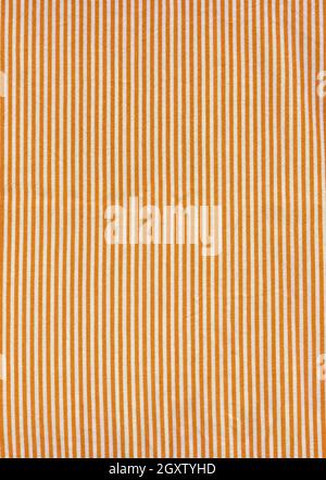 Orange striped tablecloth background texture. Fabric wallpaper Stock Photo