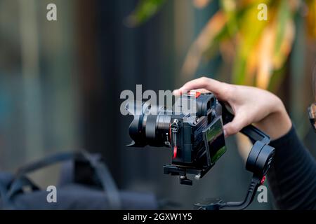 Bangkok,Thailand 2 February 2020: Videoman holding FILMING WITH DJI RONIN M handheld AND SONY A7R mark III. Full-Frame Exmor R BSI CMOS Sensor. Alpha Stock Photo