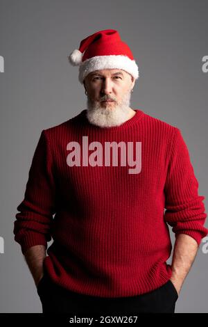 brutal bearded man in santa claus hat 