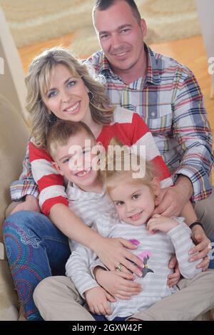 hapy young family have fun  with their children at modern living room home indoors Stock Photo