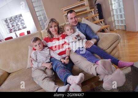 hapy young family have fun  with their children at modern living room home indoors Stock Photo