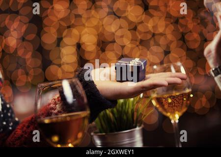 The young man gives a wedding ring   gift to  girl in restaurant Stock Photo