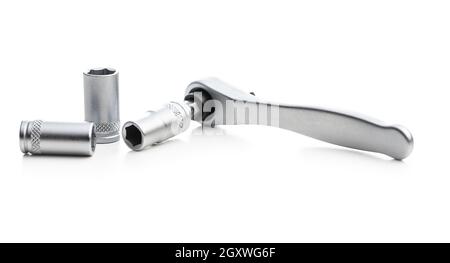 Mini ratchet wrench with set of wrench nuts isolated on white background. Ratchet wrench made from stainless steel. Stock Photo