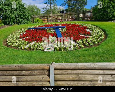 Large flower clock in a public park Stock Photo