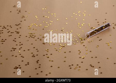 Golden sparkles stars on gold holiday background. Festive backdrop for your projects Stock Photo