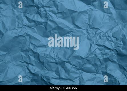 crumpled sheet of blue paper, creases and scuffs. Place for inscription Stock Photo