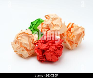 multicolored crumpled paper balls on white background, red, green and pink Stock Photo