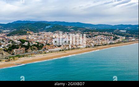 Aerial panoramic view of Canet de Mar city at dawn. Located in El ...