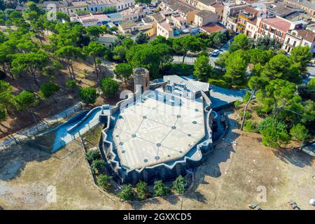 Colonia Guell, Spain - August 27, 2020: Exterior of Church, Cripta of Colonia Guell, modernist religious building designed by Antoni Gaudi. Stock Photo