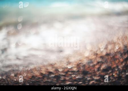 Water bokeh lights on the coastline.Natural background. Stock Photo