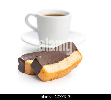 Sliced sponge dessert. Sweet sponge cake with chocolate and coffee cup isolated on white background. Stock Photo