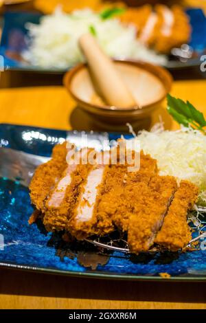 Japanese Tonkatsu (deep-fried pork cutlet) full set. It served with shredded cabbage.