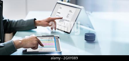 Electronic Invoice Spreadsheet Software And Corporate Invoice On Computer Stock Photo