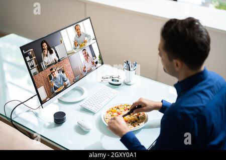Virtual Office Lunch Break Using Online Video Conference Stock Photo