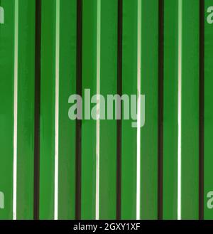 Diagonal pattern of metal profile. Fences from the galvanized iron painted by a polymeric covering. Stock Photo