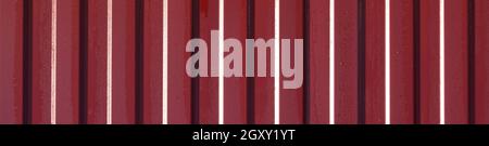 Diagonal pattern of metal profile. Fences from the galvanized iron painted by a polymeric covering. Stock Photo