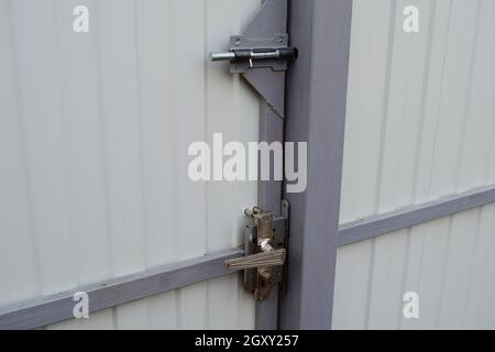 Latch on gate and the lock with the handle. A design for locking of gate from within. Stock Photo
