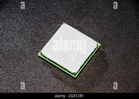 The processor of the computer with the thermal paste applied on it. Details of the computer's system unit Stock Photo