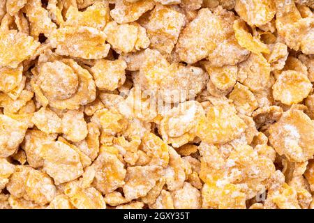 food background - raw sugar coated cornflakes Stock Photo