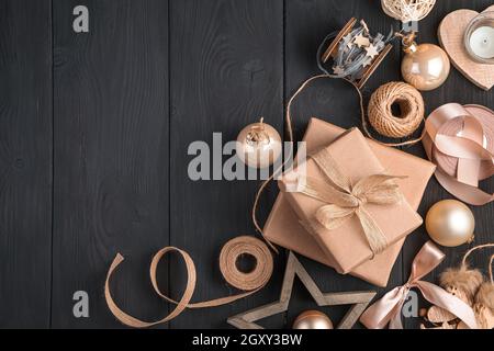 Christmas composition with gifts and toys in golden and beige colors. Top view, copy space. Stock Photo