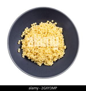 top view of boiled ptitim pasta (israeli couscous) in gray bowl isolated on white background Stock Photo