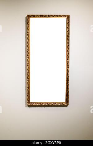 narrow tall picture frame with cutout canvas on gray brown wall Stock Photo