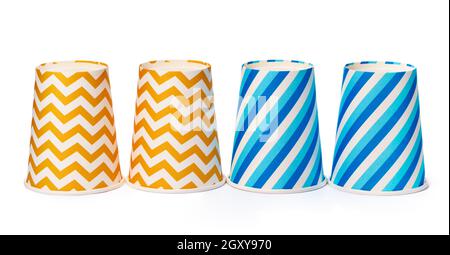 Paper disposable cups with colored pattern isolated on white background Stock Photo