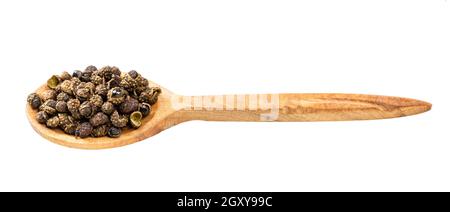 wooden spoon with sichuan pepper peppercorns isolated on white background Stock Photo