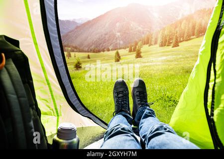 Adventure Travel Camp. Nature Vacation. Landscape View Inside Hiking Tent Stock Photo