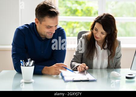 Lawyer Contract Mediation And Review. Two Reading Corporate Document Stock Photo