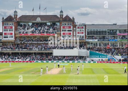 England’s Alastair Cook celebrates scoring 100 during his final test match at The Kia Oval, London. Stock Photo