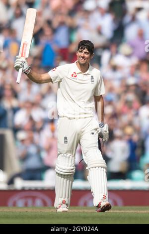 England’s Alastair Cook celebrates scoring 100 during his final test match at The Kia Oval, London. Stock Photo